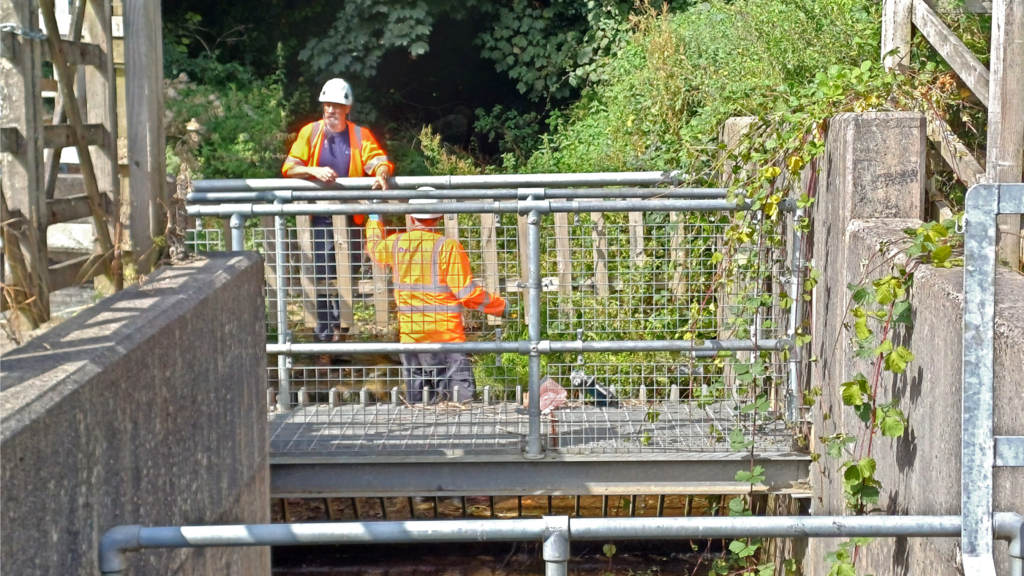 Installers working together to install a UDlive device.